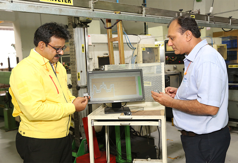 Harsha Engineers’ Himanshu Parekh (right) and Sandvik Coromant’s Ravi Gowdara study the results after installing CoroPlus® ProcessControl (photo)