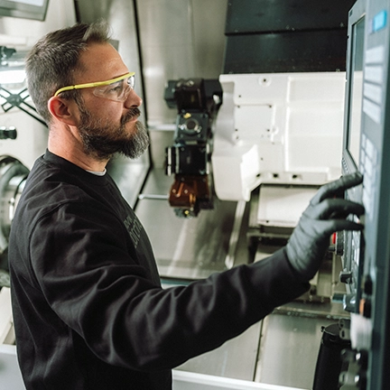 Machining and Intelligent Manufacturing: Nicola Losurdo, Center Technician, operates a CNC machine at Sandvik Coromant in Milan (Italy) (photo)